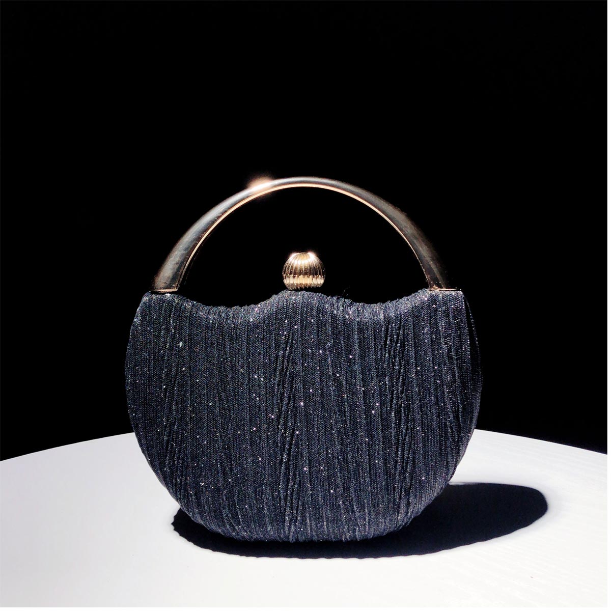 Elegant Handbag with Luxury Round Handle and Spacious Interior