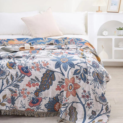 Boho-bomuldstæppe med blomstermotiv og frynsekanter