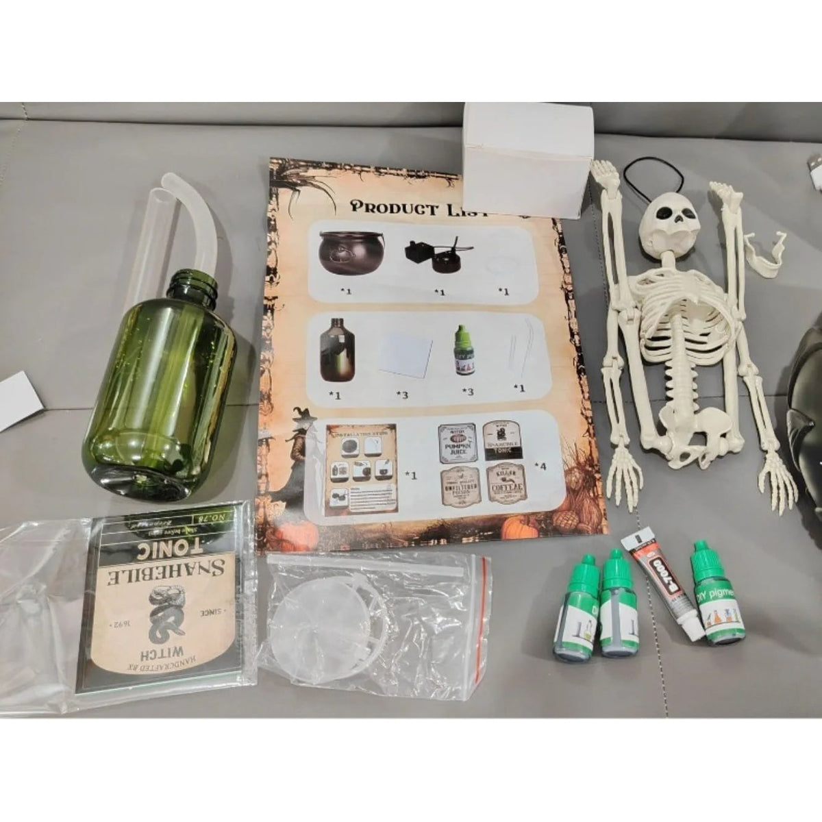 Calderone da strega di Halloween con nebulizzatore, luci LED e bottiglia galleggiante