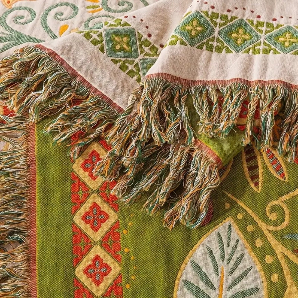 Vendbart boho-sofa- og sengetæppe med efterårsbladmønster
