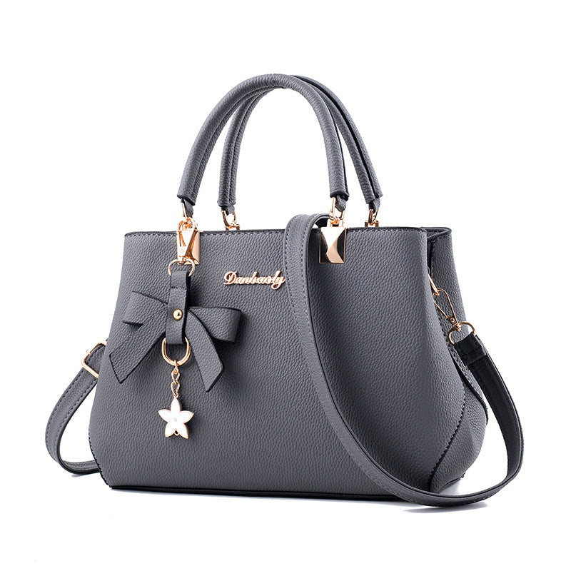 Women Shoulder Bag with Star Charm Bow Detail Soft Handle Modern Structured Handbag